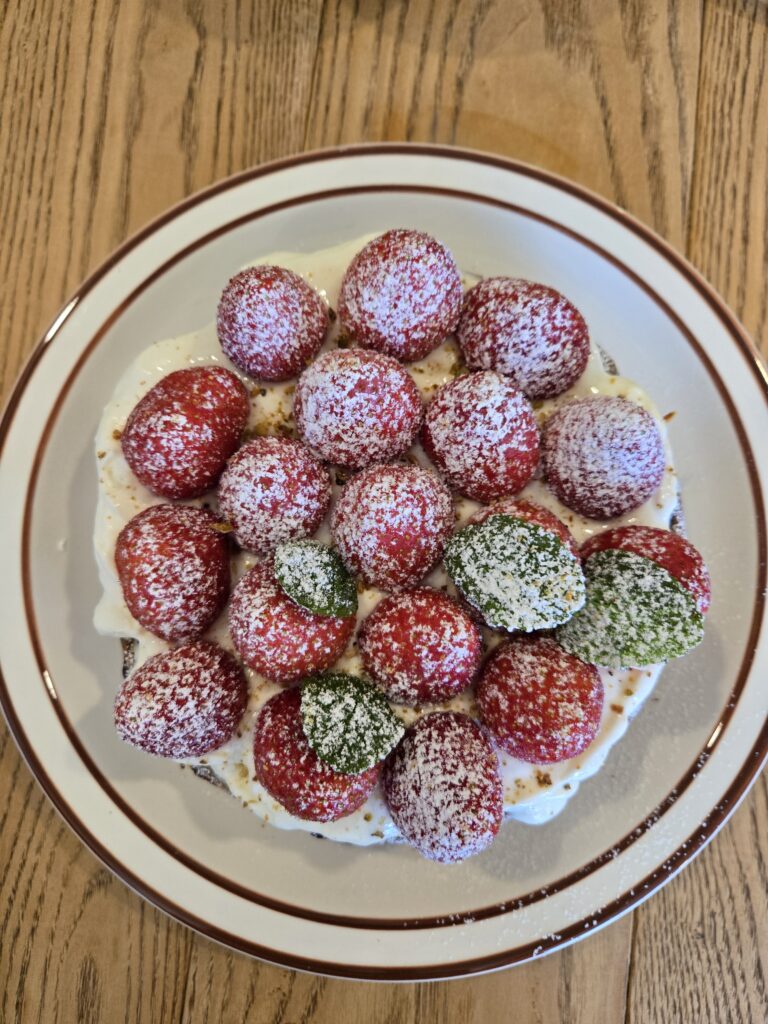 Crispy waffle topped with unique tangy yogurt whipped cream at Ruver Coffee.